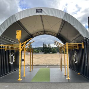 A BeaverFit SunPro shelter connects two Performance Lockers at Joint Base Lewis-McChord, enabling all-weather outdoor training.